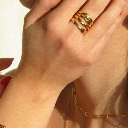 Adjustable wavy gold Laguna Ring on hand