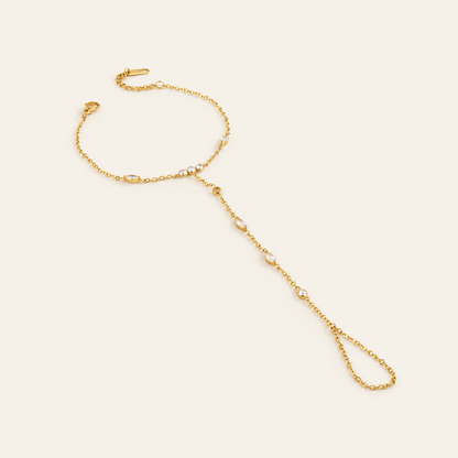 Waterproof and tarnish proof gold marquise cut hand chain with round stones.