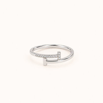 Silver waterproof ring with clear pavé stones and a polished silver finish, photographed on a soft ivory background.