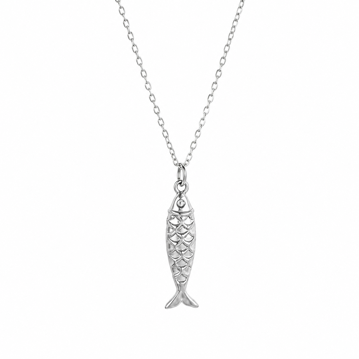 A silver fish pendant necklace with a detailed scale pattern, hanging from a delicate silver chain against a plain white background.
