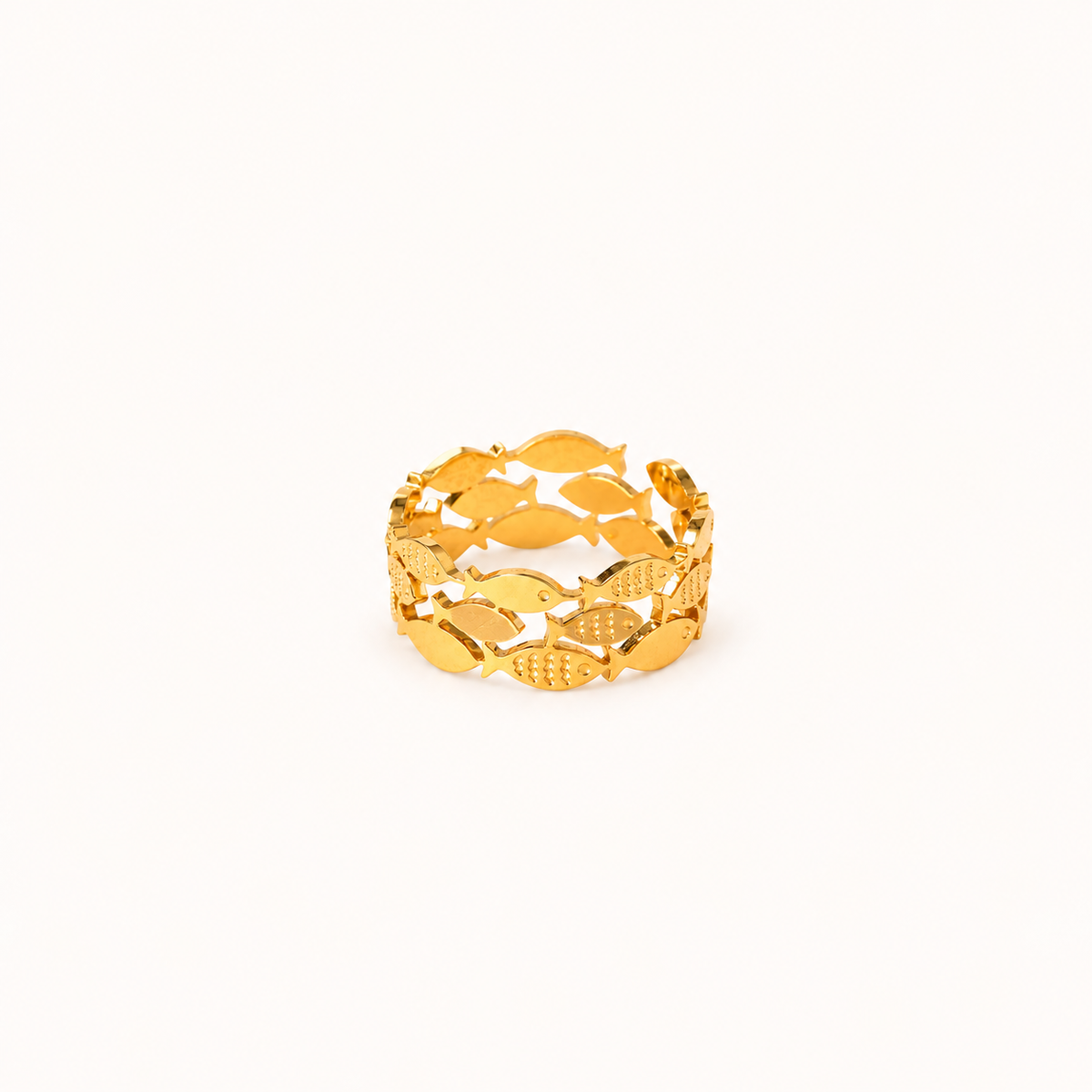 A gold-colored waterproof adjustable ring featuring a continuous pattern of fish, displayed on a clean, solid off-white background.