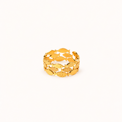 A gold-colored waterproof adjustable ring featuring a continuous pattern of fish, displayed on a clean, solid off-white background.