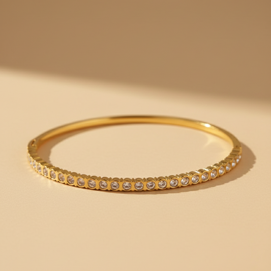 Gold bracelet with small stones